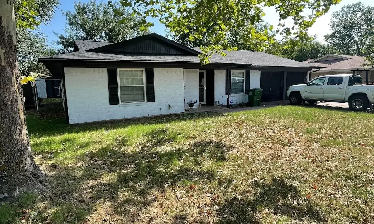 Professional roofing crew working on a residential roof in Rio Linda